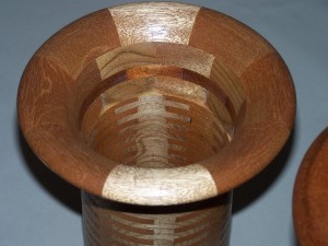 Segmented wood turning. Cherry and Mahogany vases use finger joinery to create a turning blank.