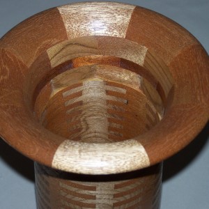 Segmented wood turning. Cherry and Mahogany vases use finger joinery to create a turning blank.