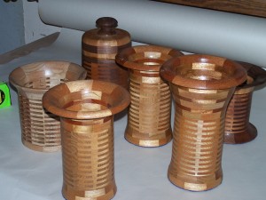 Segmented wood turning. Cherry and Mahogany vases use finger joinery to create a turning blank.