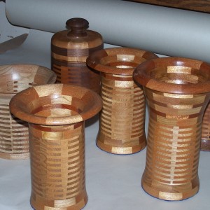 Segmented wood turning. Cherry and Mahogany vases use finger joinery to create a turning blank.