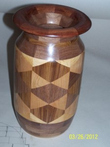 Walnut vase constructed out of triangles