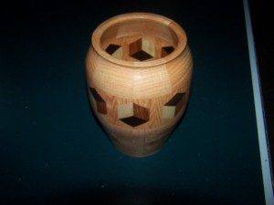 Segmented Wood turning. Honey Locust vase with 3D highlight ring of tumbling block design.
