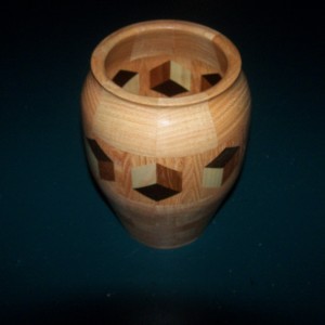 Segmented Wood turning. Honey Locust vase with 3D highlight ring of tumbling block design.