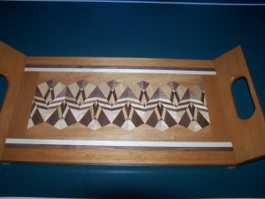 A non-standard 3 generation serving tray bordered with cherry.