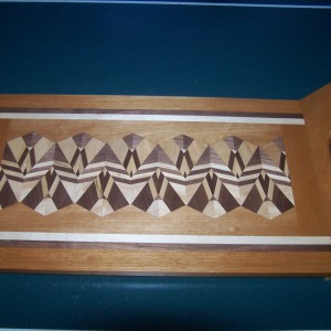 A non-standard 3 generation serving tray bordered with cherry.