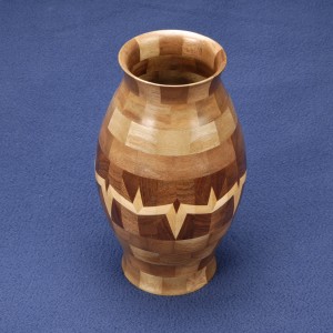 Multi generational segmented wood turning. Walnut vase with maple, 3 generation lamination design.