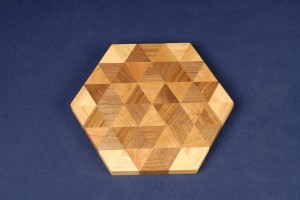 Triangles of teak, cherry, birch and walnut form this cutting board.