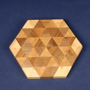 Triangles of teak, cherry, birch and walnut form this cutting board.