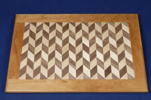 This 2 generation walnut and birch platter is framed in cherry.