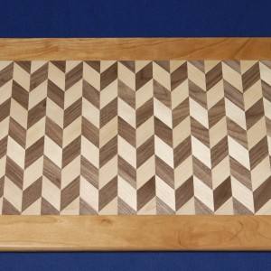 This 2 generation walnut and birch platter is framed in cherry.