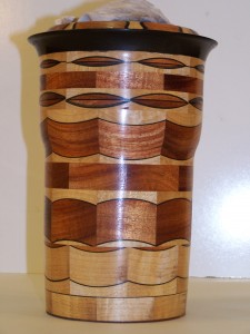 Segmented Wood turning, this unique vase is of ebony , mahogany and maple.