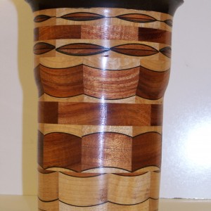 Segmented Wood turning, this unique vase is of ebony , mahogany and maple.