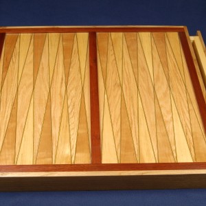 This 24 by 24 inch backgammon board is easier than it looks. Includes drawers.