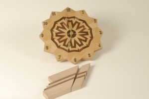 A simple 3 generation pattern of walnut and maple formed into a circle to create this wall clock.
