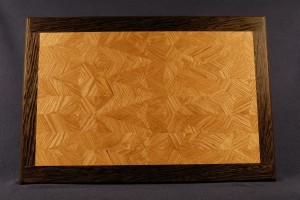 This multi generation 45/60A60AD is of white oak, with a wenge boarder. The piece accents the grain and needs on contrast in color to show off the intricate designs and patterns. A spline was used to affix the boarder.