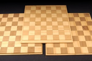 Chess blanks of ash, walnut and mahogany are mounted to a substrate and ready for application in your project.